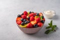 Fresh fruit salad with different ingredients with mint and sour cream. Healthy diet. Copy space for text. Top view Royalty Free Stock Photo