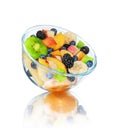 Fresh fruit salad in a glass bowl with reflection Royalty Free Stock Photo