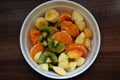 Fresh fruit salad with orange, kiwi, apple and banana
