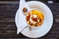 Fresh fruit salad in a plate on a wooden background Royalty Free Stock Photo