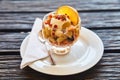 Fresh fruit salad in a plate on a wooden background Royalty Free Stock Photo