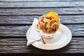 Fresh fruit salad in a plate on a wooden background. Royalty Free Stock Photo