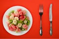 Fresh fruit salad on white plate on background. healthy food top view Royalty Free Stock Photo