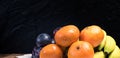 Fresh fruit selection against dark background Royalty Free Stock Photo