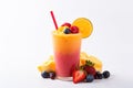 Fresh fruit smoothies fruits orange juice drink straw in a cup on white background Royalty Free Stock Photo