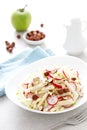 Fresh fruit and vegetable salad with kohlrabi, green apple, radish and hazelnuts Royalty Free Stock Photo