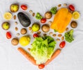 Fresh fruit and vegetables, grains, and nuts on a white background in shape of heart. Royalty Free Stock Photo