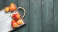 Fresh fruit on a white wooden tray: banatas, pears, apricots. Countryside setting. Top view. Royalty Free Stock Photo