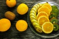 Fresh fruits banana, kiwi, orange on wooden background. Healthy food. A mix of fresh fruit. Group of citrus fruits. Vegetarian raw Royalty Free Stock Photo