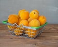 Fresh fruits. Basket with apricots on a wooden table Royalty Free Stock Photo