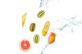 Fresh fruits falling in water splash, isolated on white background Royalty Free Stock Photo