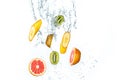 Fresh fruits falling in water splash, isolated on white background Royalty Free Stock Photo