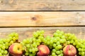 Fresh fruits grapes and peach on wooden rustic table.