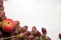 Fresh fruits grapes, pear and apple on wooden boards frame background. Royalty Free Stock Photo