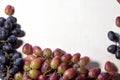 Fresh fruits grapes, pear and apple on wooden boards frame background. Royalty Free Stock Photo