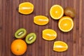 Fresh fruits kiwi, orange isolated on wooden background. Healthy food. A mix of fresh fruit. Group of citrus fruits. Vegetarian. Royalty Free Stock Photo