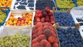 Fresh fruits, peaches, plums, grapes, nectarines on supermarket shelves. Retail industry. Farmers market. Discount. Grocery shoppi