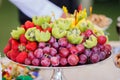 Fresh fruits on plate. Strawberries, kiwi, grapes on catering banquet table. Royalty Free Stock Photo