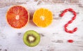 Fresh fruits and question mark made of medical pills, choice between healthy nutrition and medical supplements Royalty Free Stock Photo
