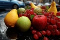 Fresh fruits on a rain soaked street, captured from an elevated angle Royalty Free Stock Photo