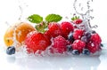 Fresh fruits only red color fall in water. Ripe orange, and berries with water splash isolated on white background. Royalty Free Stock Photo