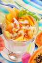 fresh fruits salad with papaya,banana,orange,pineapple and coconut