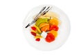 Fruits salad on plate isolated on white Royalty Free Stock Photo