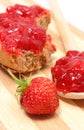 Fresh fruits and strawberry jam on wooden cutting board Royalty Free Stock Photo