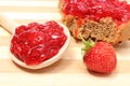 Fresh fruits and strawberry jam on wooden cutting board Royalty Free Stock Photo