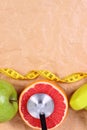 Fresh fruits, centimeter, stethoscope and dumbbells for fitness, healthy lifestyles Royalty Free Stock Photo