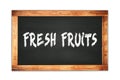 FRESH FRUITS text written on wooden frame school blackboard