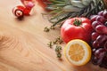 Fresh fruits and tomato on wooden table. Healthy food concept Royalty Free Stock Photo