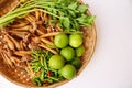 Fresh fruits, vegetables and herbs in a wicker basket isolated on white background closeup. Royalty Free Stock Photo