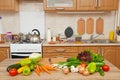 Fresh fruits and vegetables on the table in kitchen interior, healthy food concept Royalty Free Stock Photo