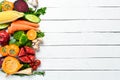 Fresh fruits and vegetables on white wooden background. Healthy food. Top view. Royalty Free Stock Photo