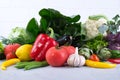 Fresh fruits and vegetables on wooden background. bok choy pepper cabbage greens artichoke zucchini cucumber tomato garlic