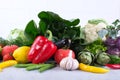 fresh fruits and vegetables on wooden background. bok choy pepper cabbage greens artichoke zucchini cucumber tomato garlic