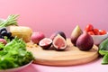 Fresh fruits and vegetables on wooden cutting board Royalty Free Stock Photo