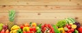 Fresh fruits and vegetables on wooden wall background Royalty Free Stock Photo