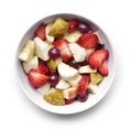 Fresh fruits in a white bowl, breakfast scene Royalty Free Stock Photo