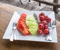 Fresh fruits on a white plate Royalty Free Stock Photo