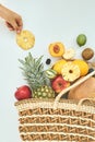 Fresh fruits in a wicker eco-friendly bag on white background Royalty Free Stock Photo