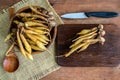 Fresh galingale (Boesenbergia rotunda) on wooden table