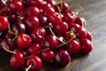 Fresh garden cherries on wooden table. Summer harvest. Delicious red berries. Royalty Free Stock Photo