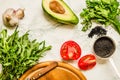 Fresh garden greens, tomatoes and cucumbers on cooking table. Top view.Clean eating diet. Diet food concept. Healthy food Royalty Free Stock Photo