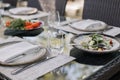 Fresh garden salad on an elegantly set outdoor dining table, perfect for al fresco dining experiences Royalty Free Stock Photo