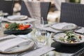 Fresh garden salad on an elegantly set outdoor dining table, perfect for al fresco dining experiences Royalty Free Stock Photo