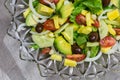 Fresh garden salad with tomato, lettuce, avocado, cucumber, pineapple, capers and olives - top view photo Royalty Free Stock Photo