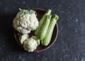 Fresh garden vegetables - cauliflower, zucchini, squash on a dark background, top view Royalty Free Stock Photo