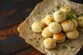 Fresh Garlic Ball bread on black plate on crumpled paper Royalty Free Stock Photo